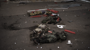 The bodies of unidentified men, believed to be Russian soldiers, arranged in a Z, a symbol of the Russian invasion, lie near a village recently retaken by Ukrainian forces on the outskirts of Kharkiv, Ukraine, on Monday, May 2.
